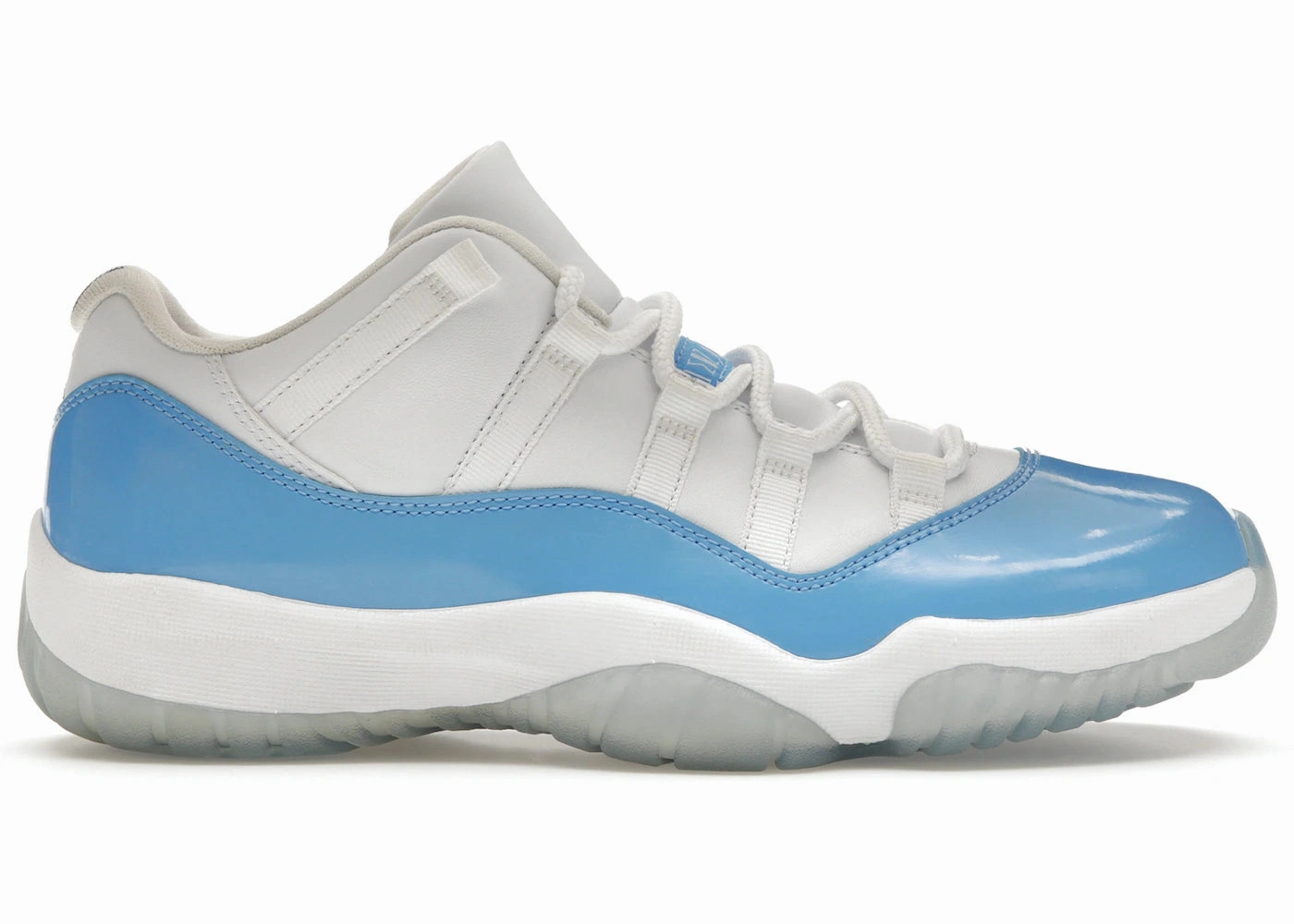 running in a park trail Jordan 11 low university blue