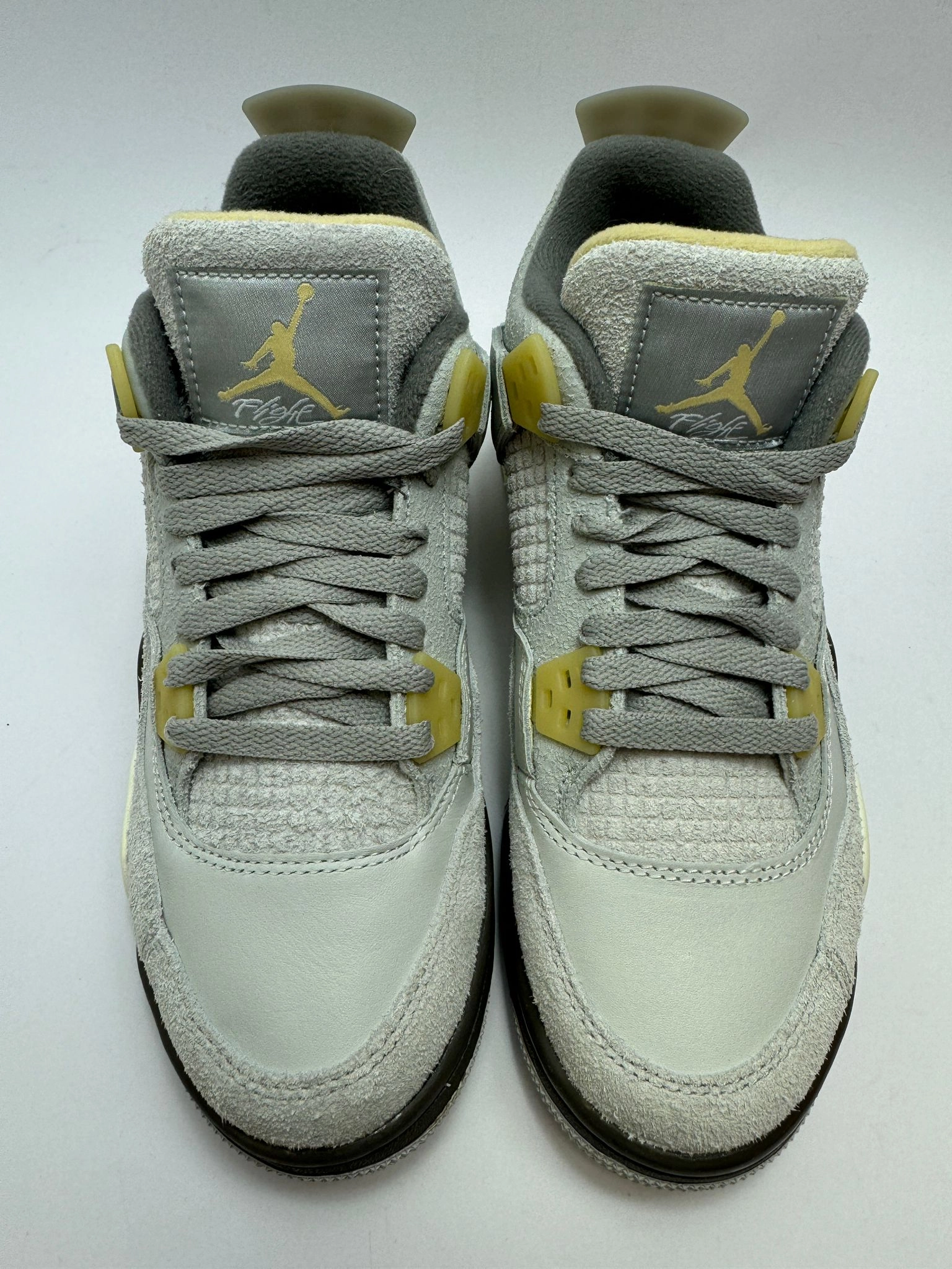 perforated upper Jordan 4 Retro SE "Craft Photon Dust"