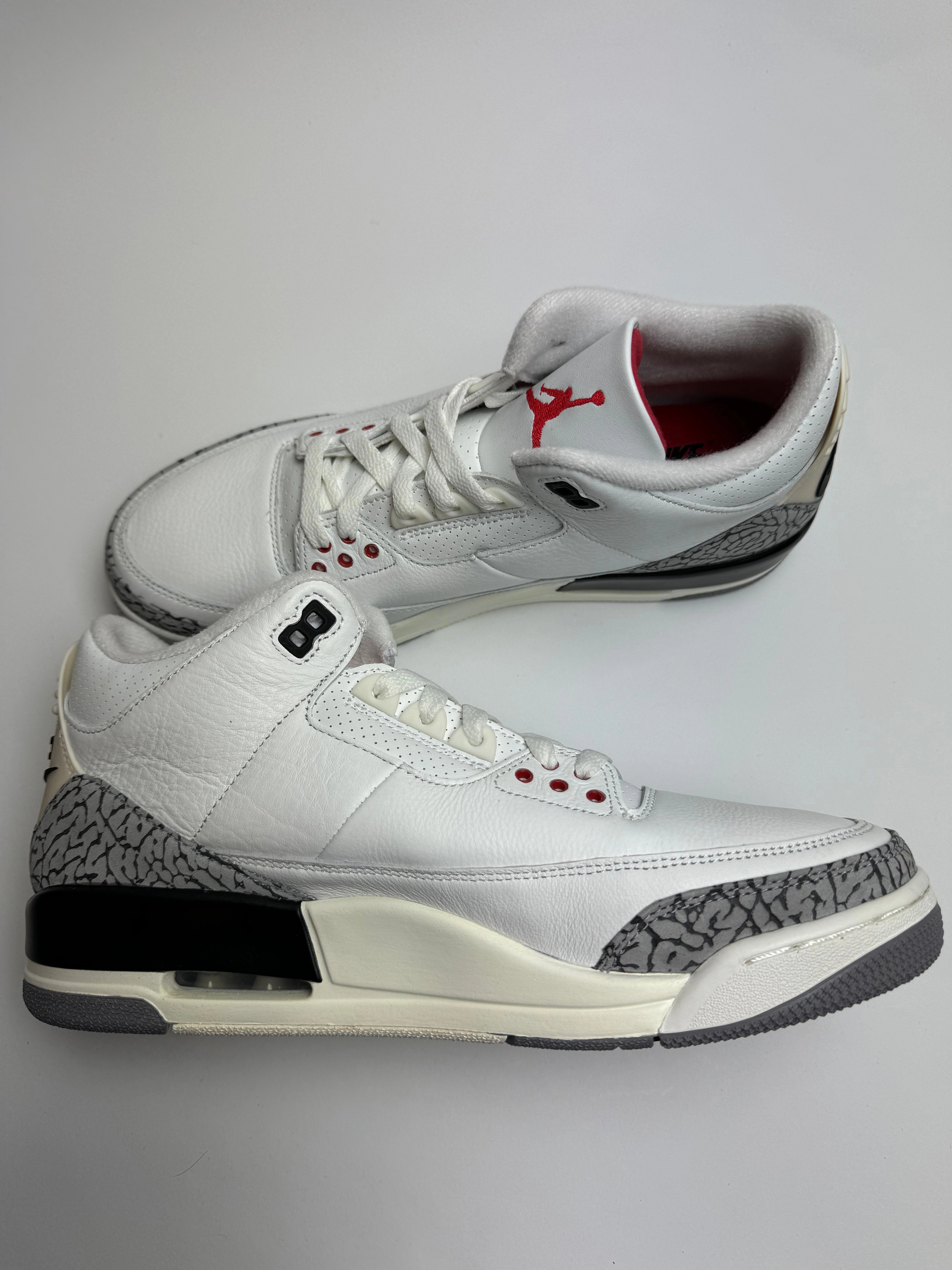 Air Jordan 3 Retro "White Cement Reimagined" hilly track running wear grassy terrain
