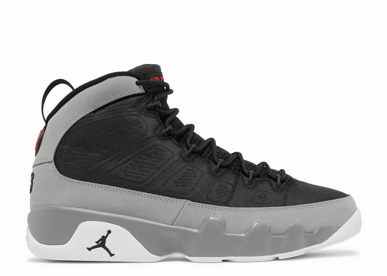 Jordan 9 Retro Particle Grey running during a foggy day