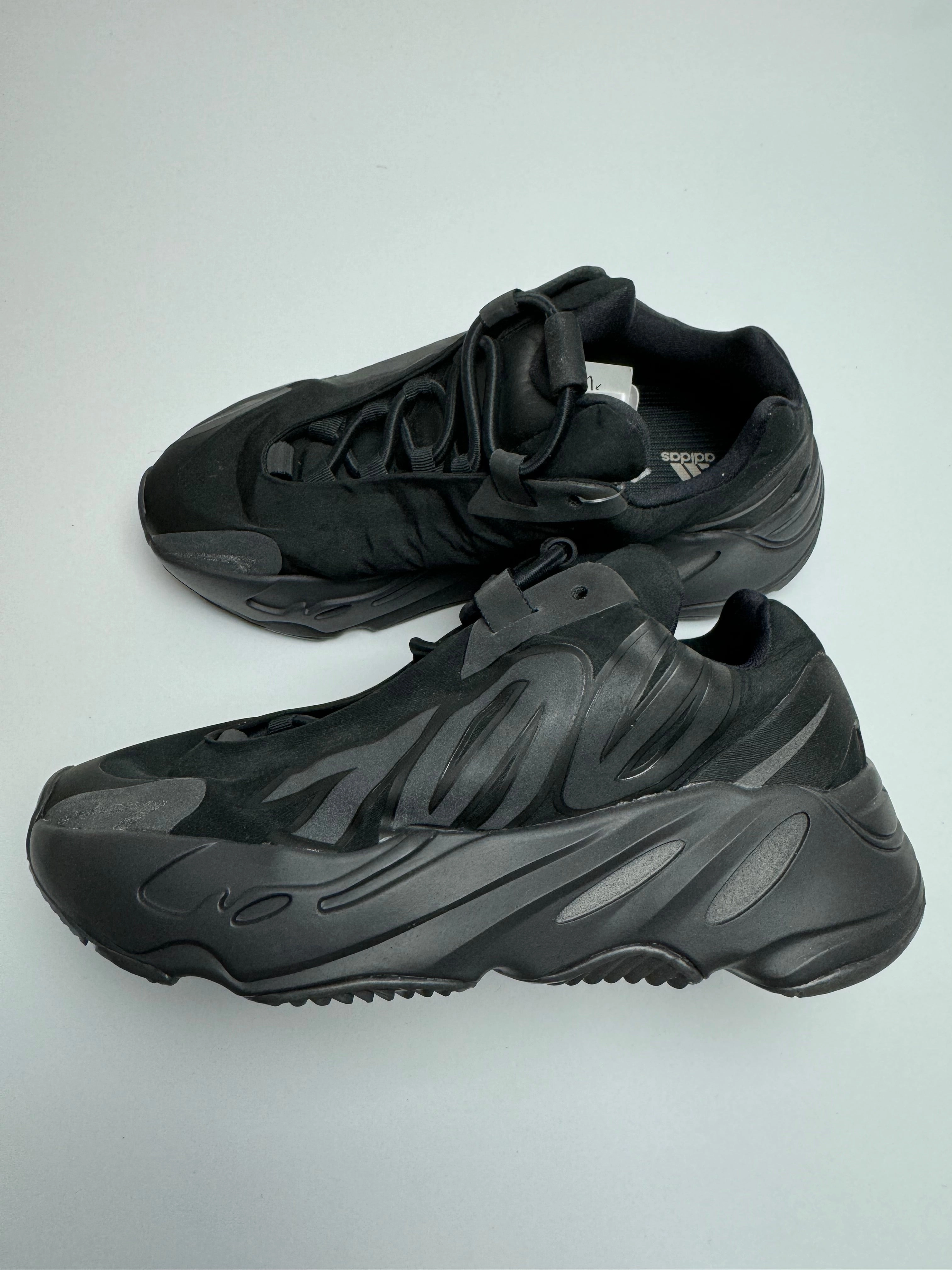 Yeezy Boost 700 MNVN "Triple Black" running in morning