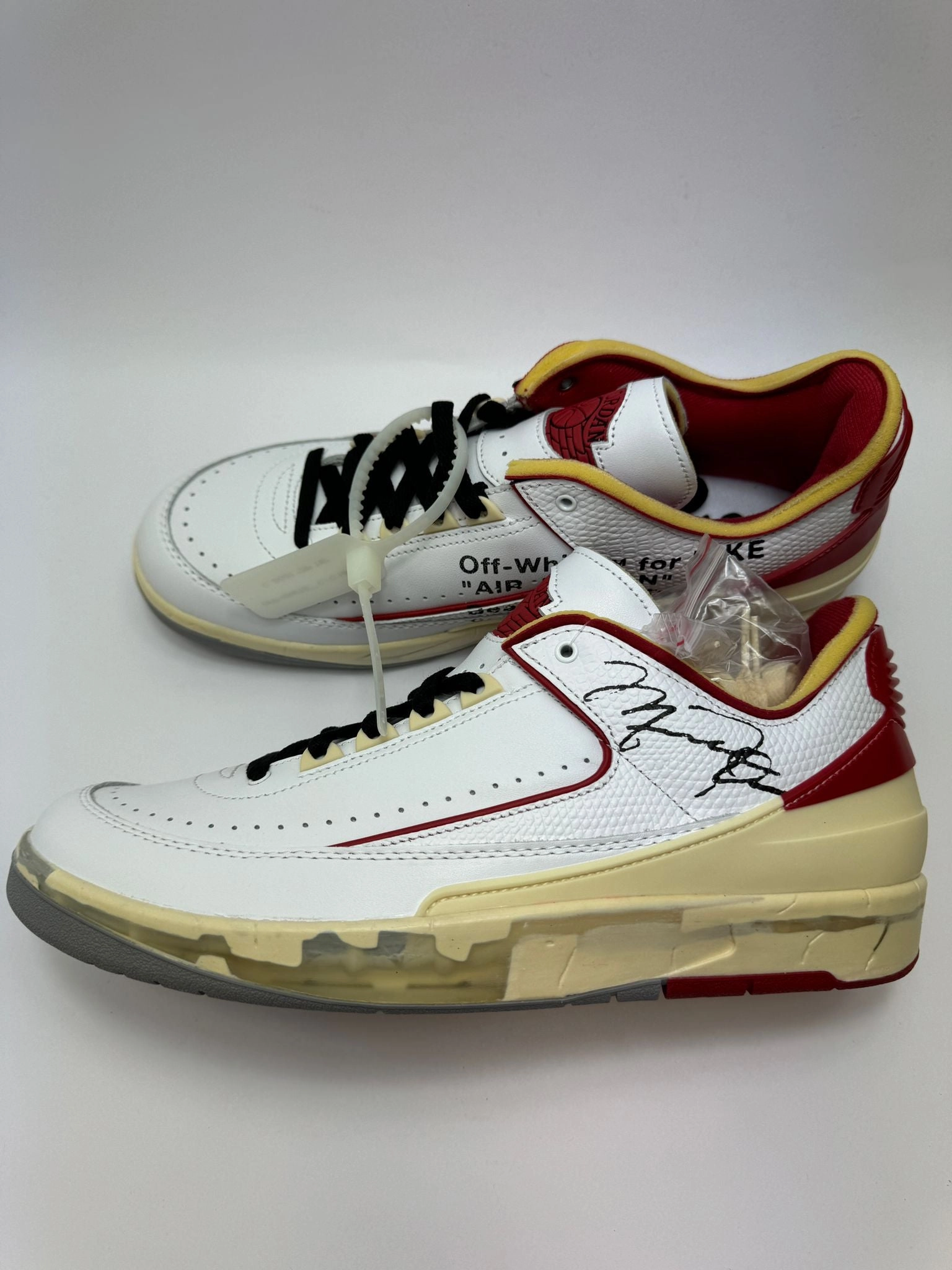 Jordan 2 Retro Low SP "Off-White White Red" running with a zipper closure post - injury running shoes