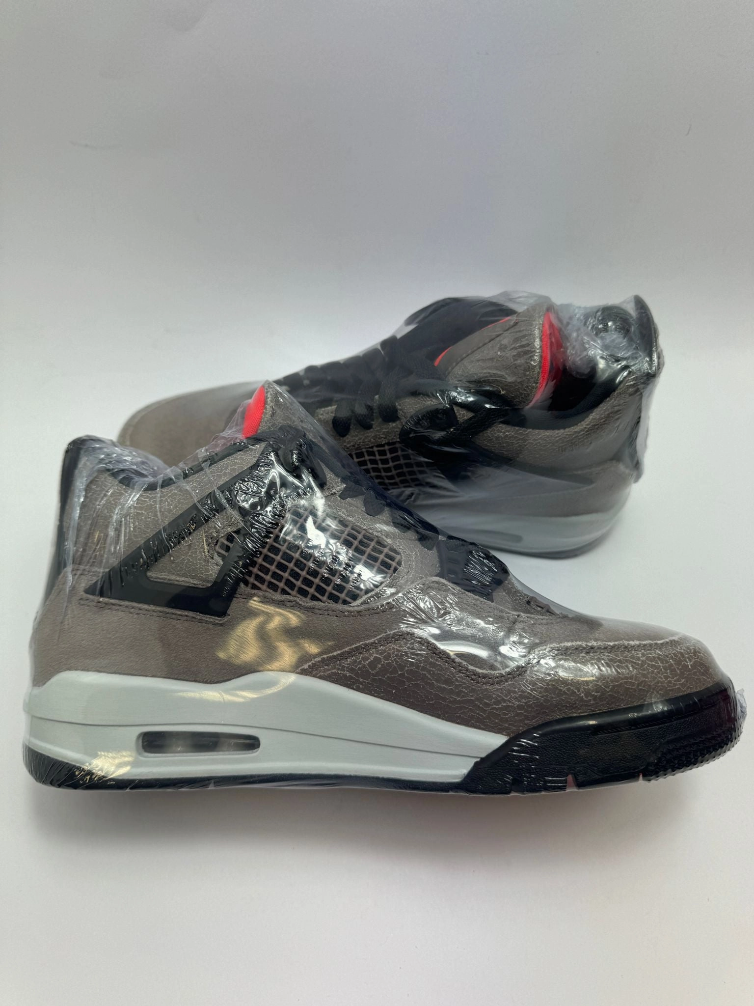 Jordan 4 Retro "Taupe Haze" Durability Guarantee running in a dam area shoes