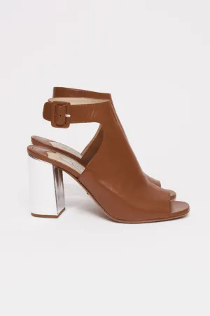 SILVER HEEL PUMPS