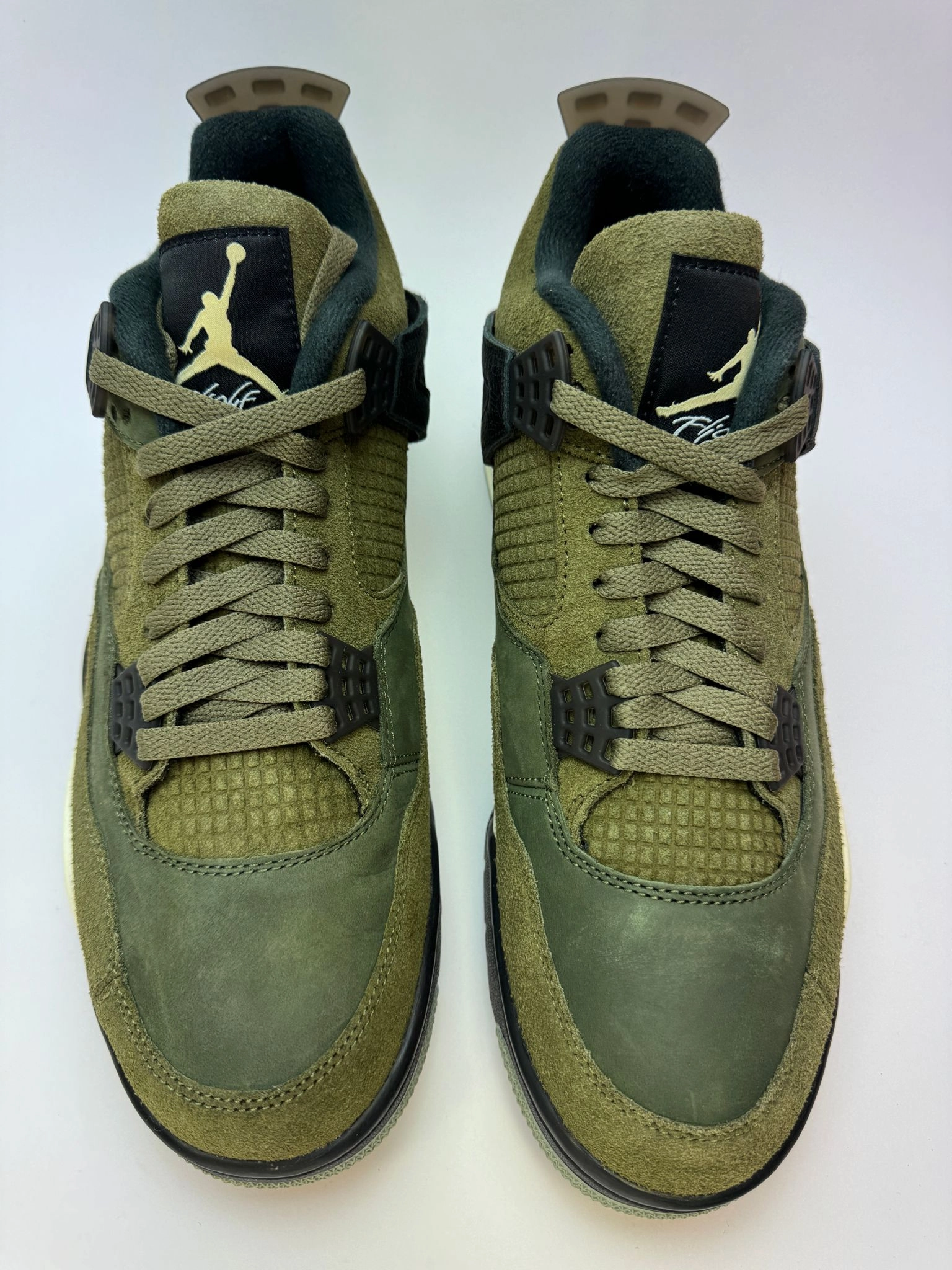 Air Jordan 4 Retro "Craft Medium Olive" running in a channel area shoes running for a form of meditation
