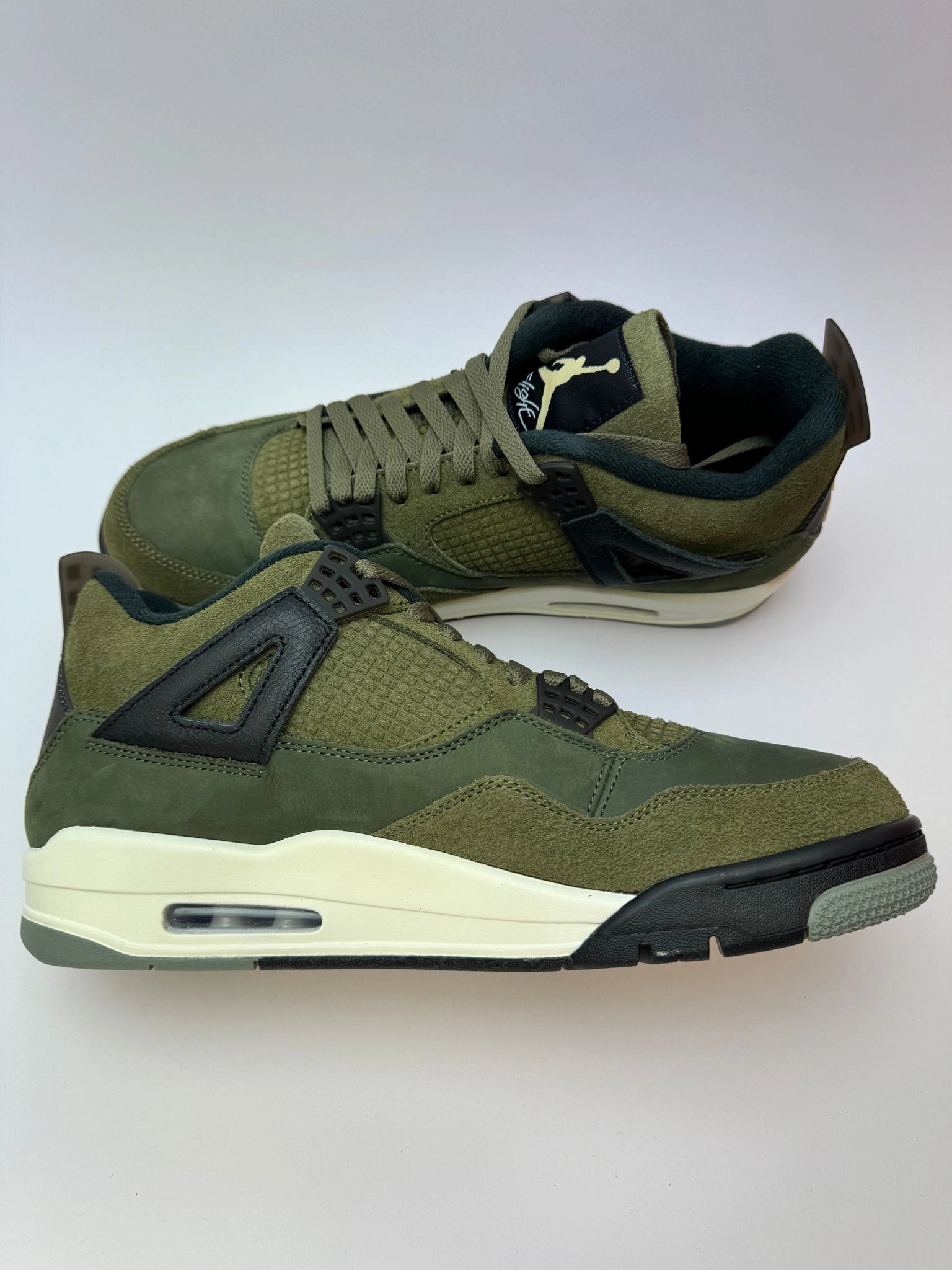 Air Jordan 4 Retro "Craft Medium Olive" sports festival running option running in a rope bridge area shoes