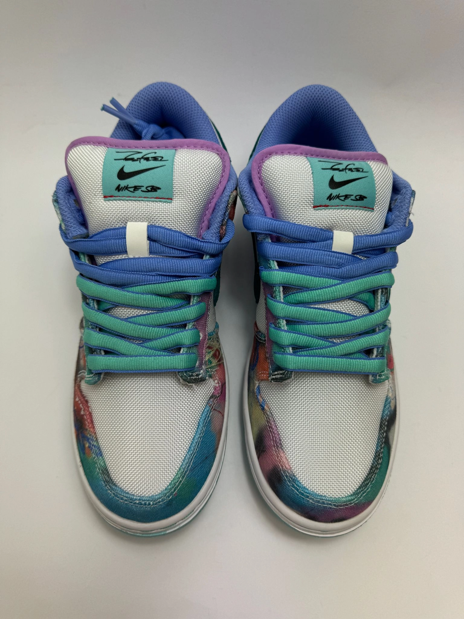 Nike SB Dunk Low "Futura Laboratories Bleached Aqua" running in a meadow shoes